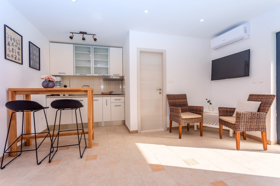 The lower ground floor offers summer kitchen with a lounge corner