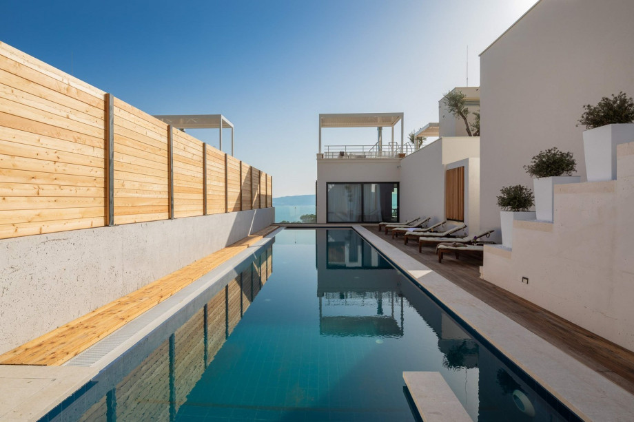 The Outdoor offers a heated private swimming pool with a hydro-massage bench 18m x 3,8m, a spacious sun deck area with 6 deck chairs, an outdoor lounge and an outdoor shower