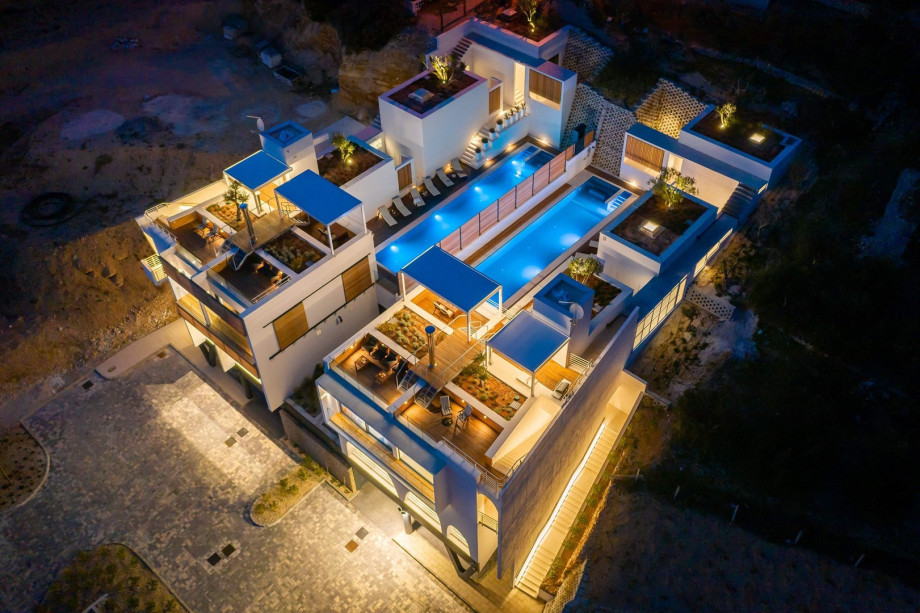 Private and heated swimming pool 18m x 3,8m and hydromassage bench, amazing sea views from the living area, with heated bench, a gym, and a rooftop terrace
