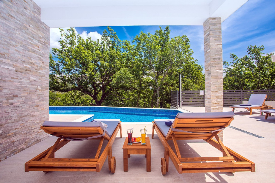 The pool area with sun deck