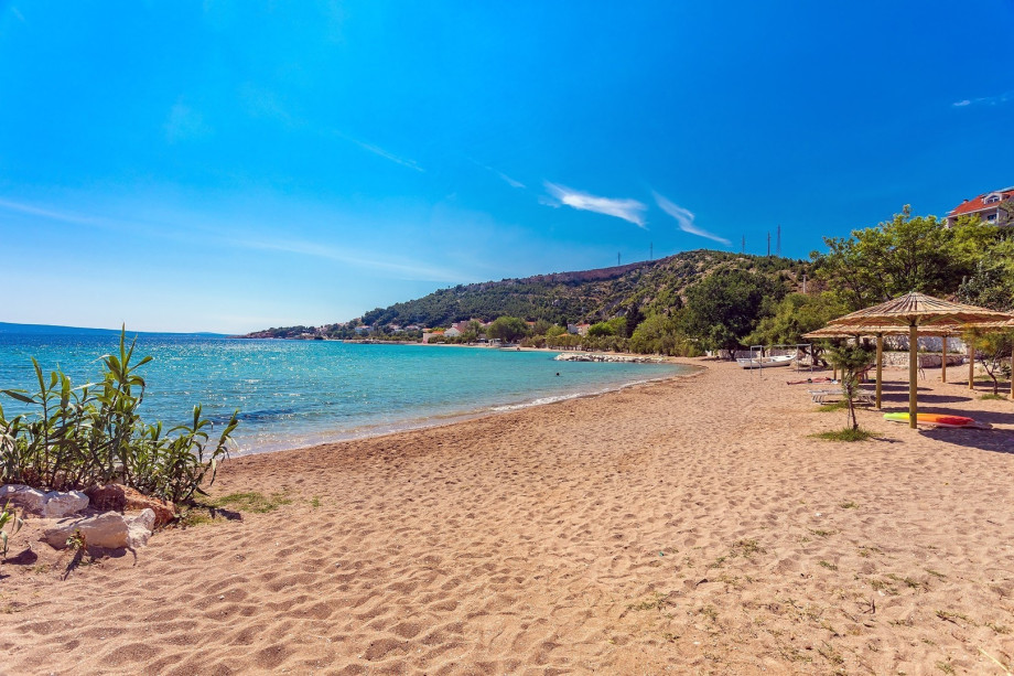 Sandy beach in Omis and Duce, with various water sports, 20km far from the villa