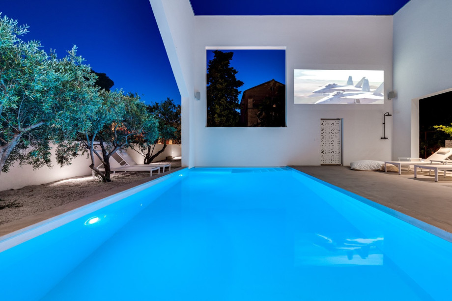 A Projector with surround-sound system (your private cinema area)