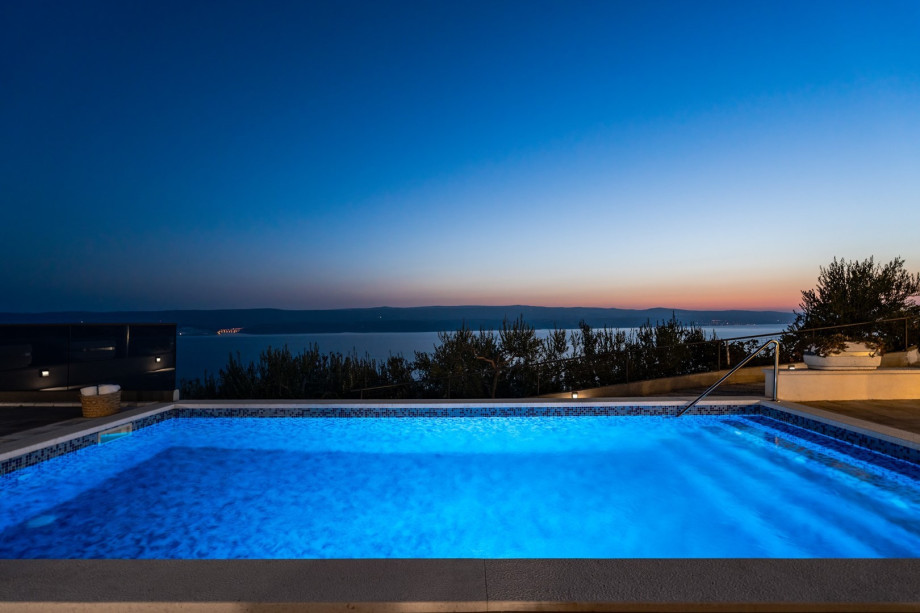 Enjoy evenings at the pool area with a glass of homemade wine