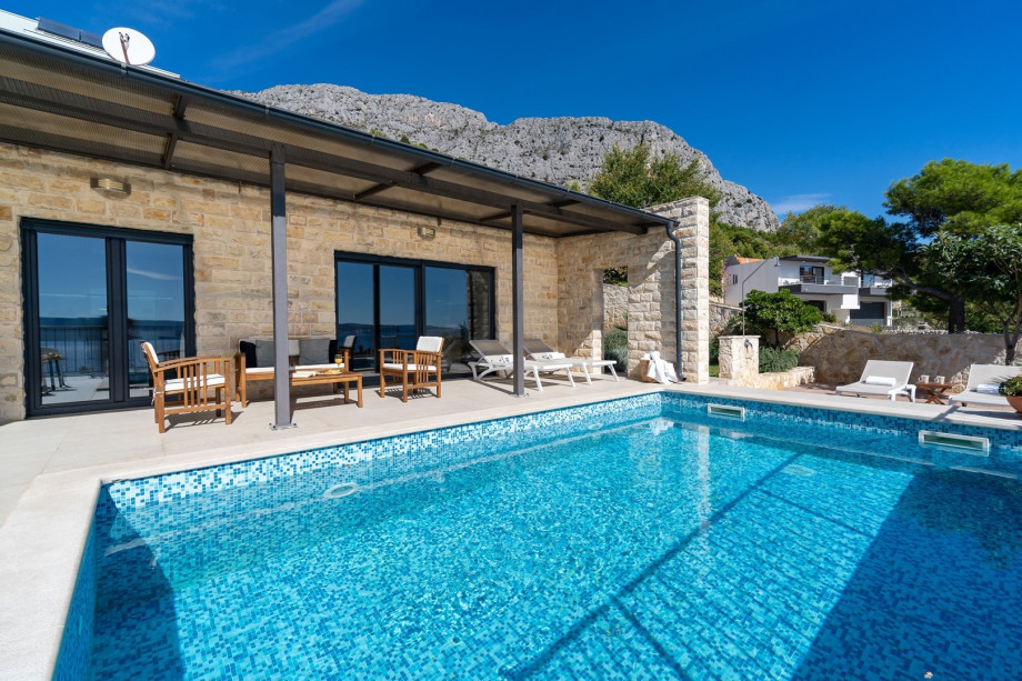 Direct exit from the kitchen and  living room to the pool area