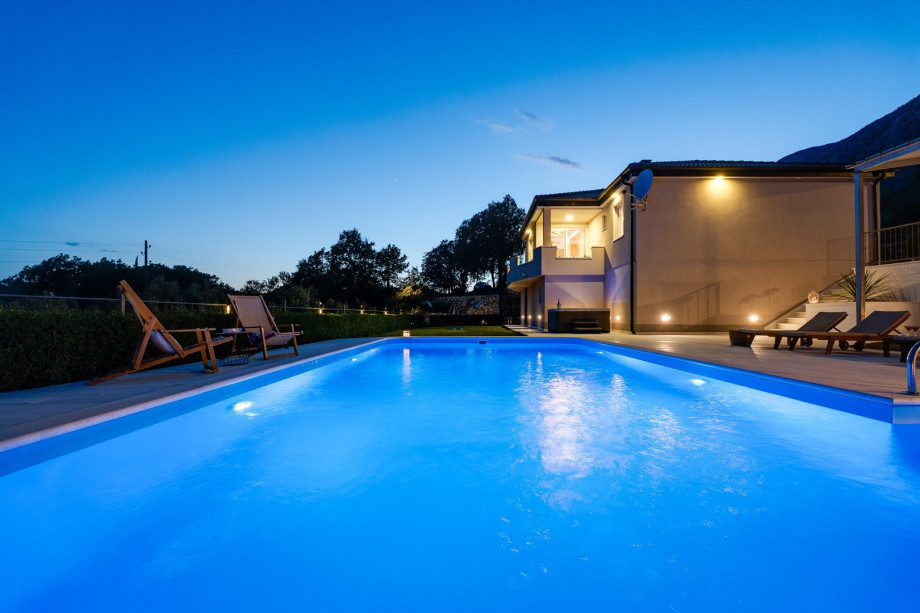 The outdoor area around the pool area is completely fenced