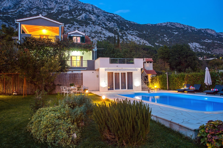 Night view of the villa and outside area.