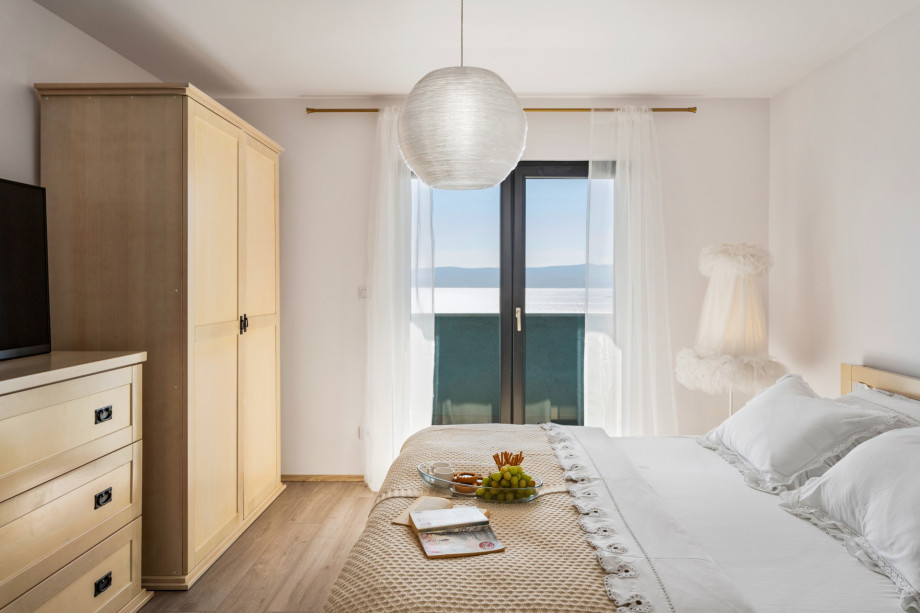 Bedroom No.1 with double bed, terrace, and en-suite bathroom