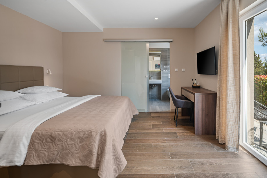 Bedroom No2 with king size bed, en-suite, TV, A/C sea views, exit to the garden