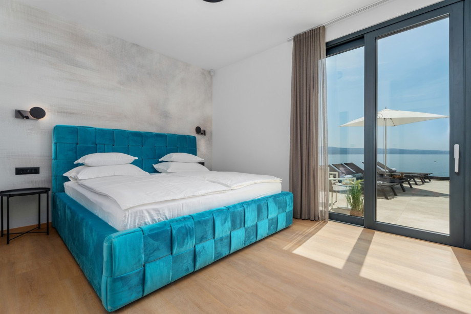 Bedroom No.1 with super king size bed 200cmx200cm, A/C, a TV and en-suite bathroom with a shower