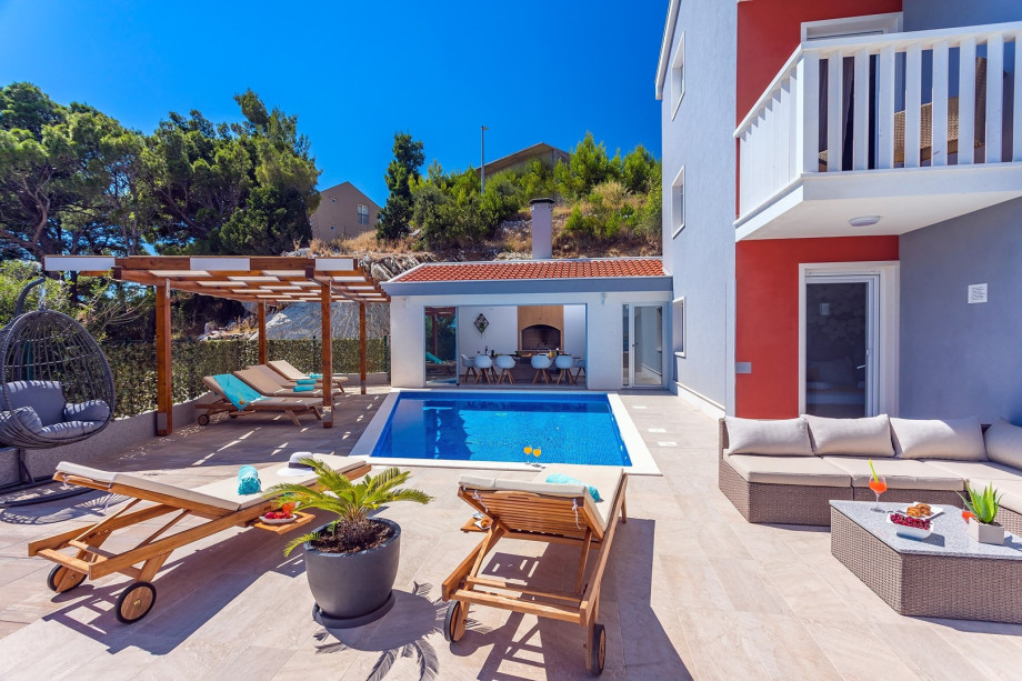 Private pool and pool area connected with summer kitchen