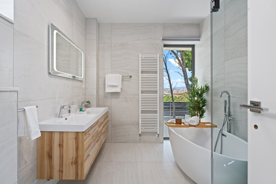 There is also an attached bathroom with a bathtub and shower