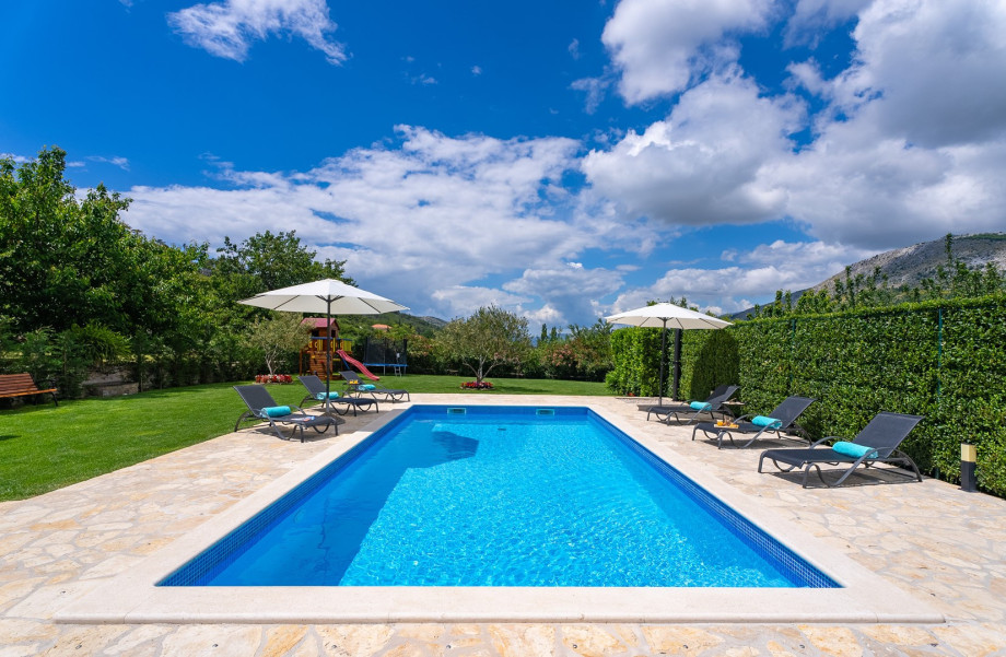The private heated swimming pool measures 8 meters by 4 meters and is not overlooked.