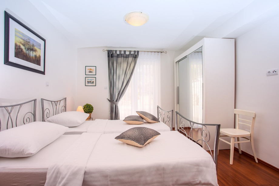 Bedroom No5 with a 3 single beds and exit to the terrace,  A/C