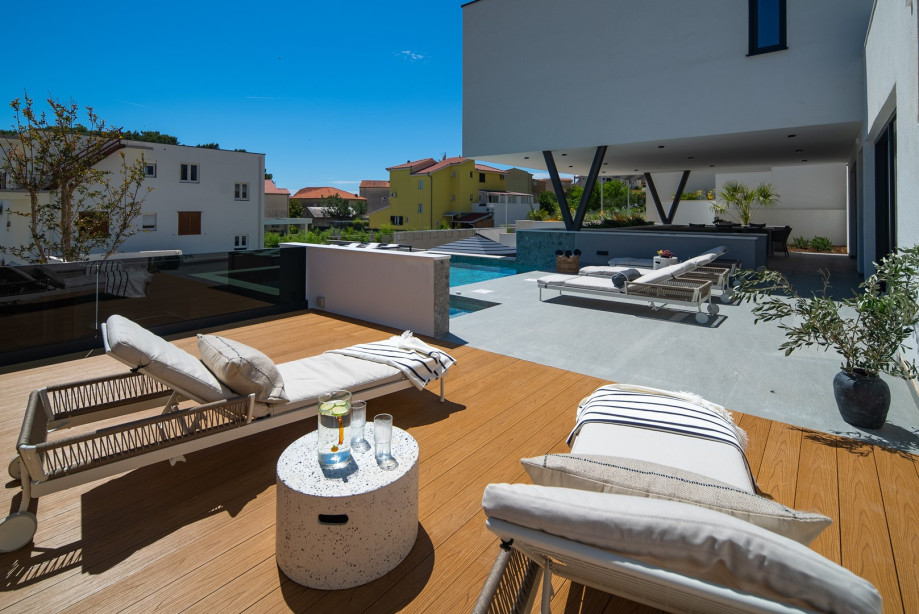 Complete with comfortable loungers and umbrellas for shade.