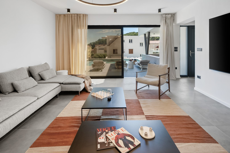 Spacious living room adorned with multiple sofas