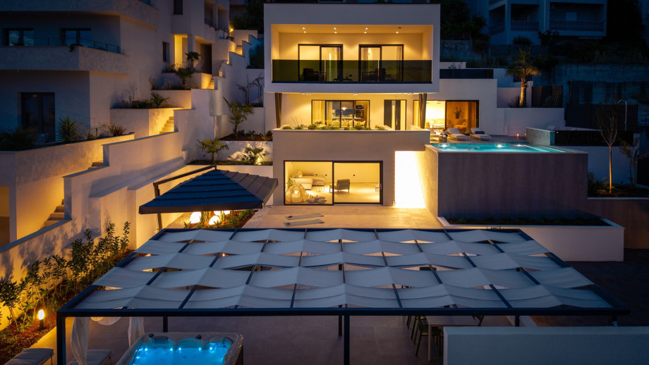 The peaceful setting creates a perfect harmony between indoor and outdoor spaces, making it ideal for memorable gatherings with family and friends