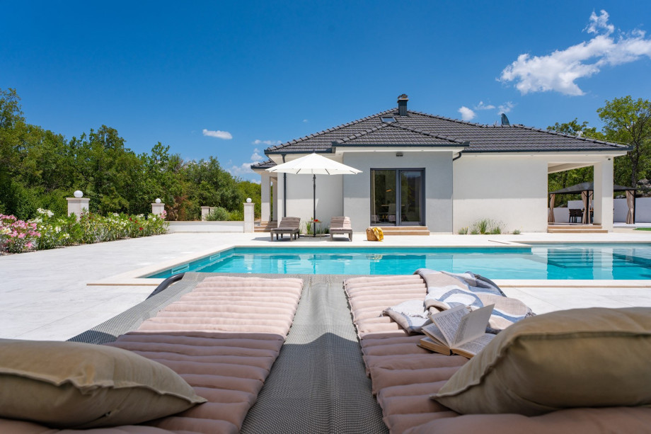 Sun deck with 6 comfortable loungers and 2 umbrellas for lazy afternoons in the sun
