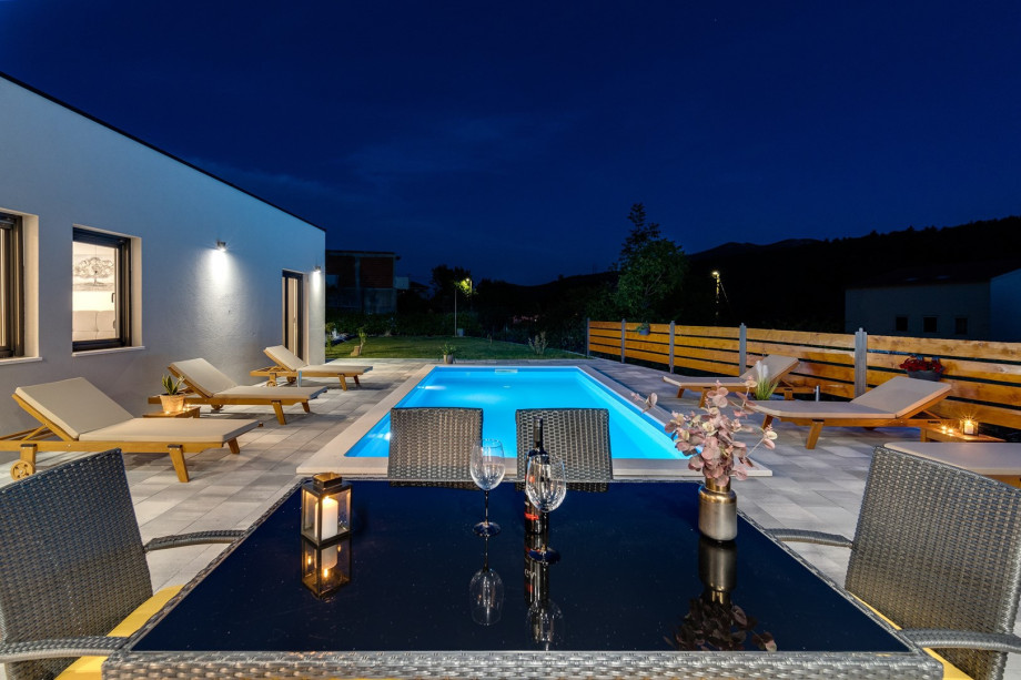 Private swimming pool with 6 deck chairs, outdoor dinning area with BBQ
