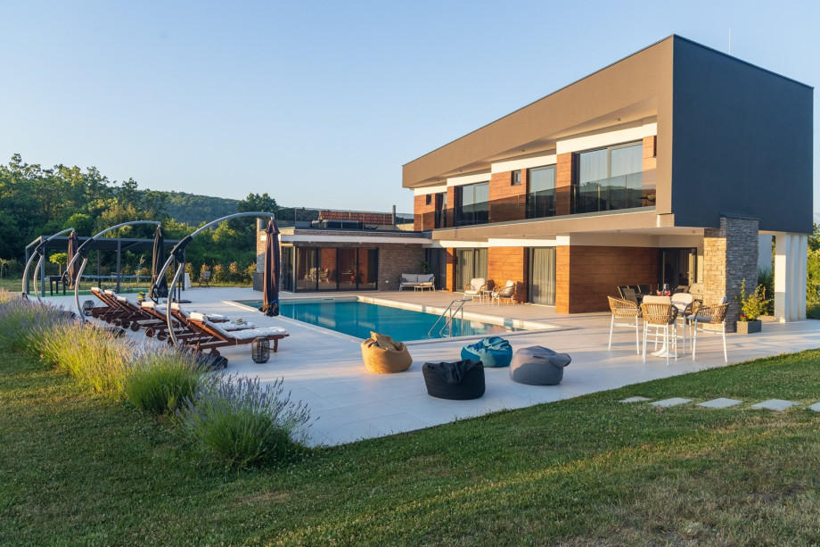 A very spacious sun deck area that offers privacy for your absolute relaxation with 6 deck chairs, 1 swinging egg chair, a swing for 2, and a lounge corner