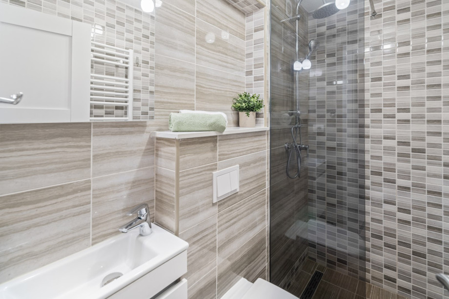 There is a family bathroom located on the first floor with a shower, a toilet and a sink