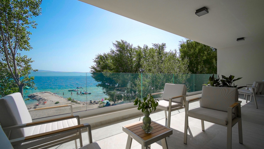 A comfortable balcony with breathtaking sea and beach views