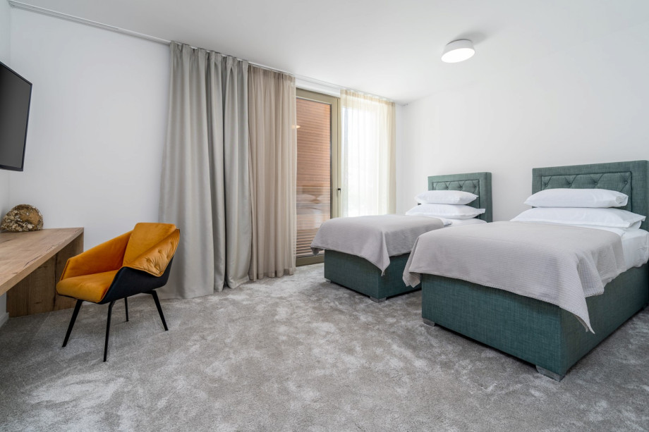 Bedroom No4 ( North, 22sqm) offering mountain views, with two single beds 90cm x 200cm that can connect into a King size bed, a TV