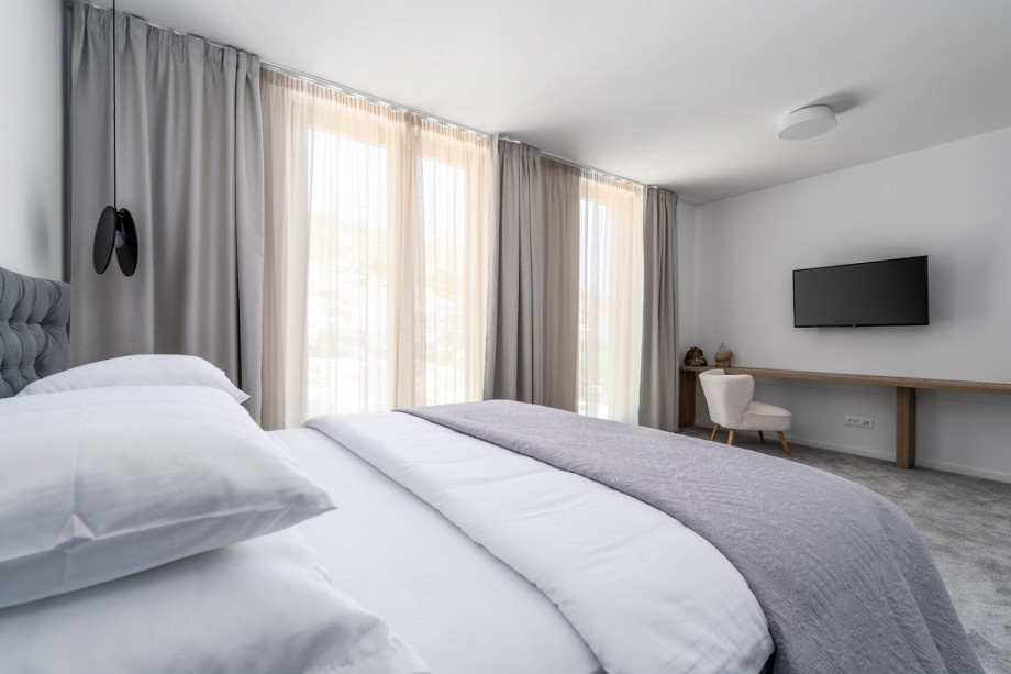 Bedroom No6 (North, 24sqm) offering mountain views, with a King size bed 200cm x 200cm, a TV