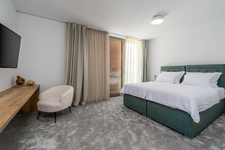 Bedroom No7 (North, 22sqm) offering mountain views, with two single beds 90cm x 200cm that can connect into a King size bed