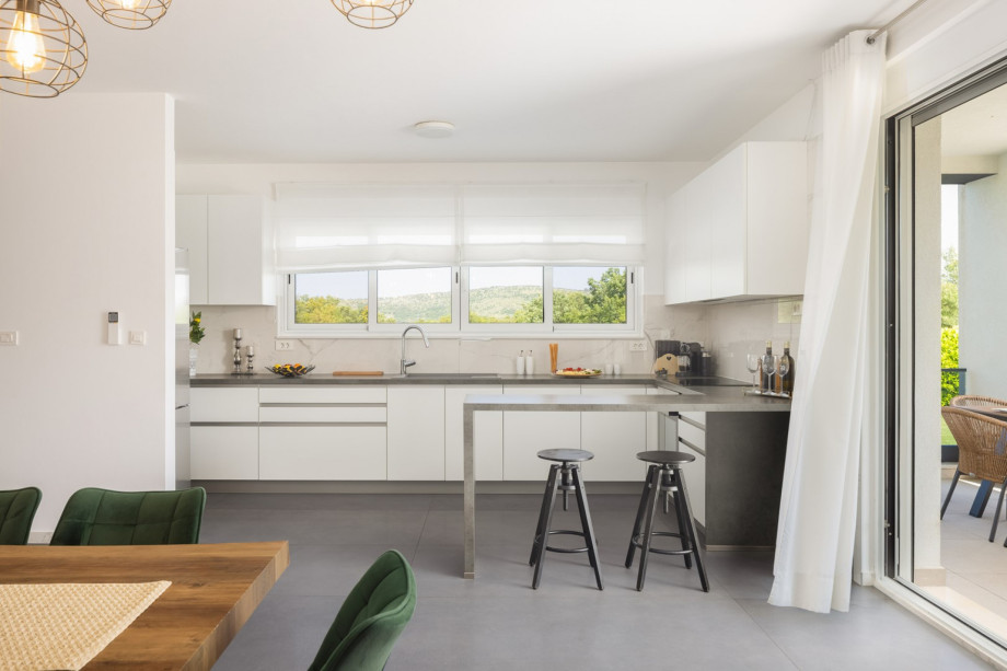 a fully equipped kitchen with a large dining area