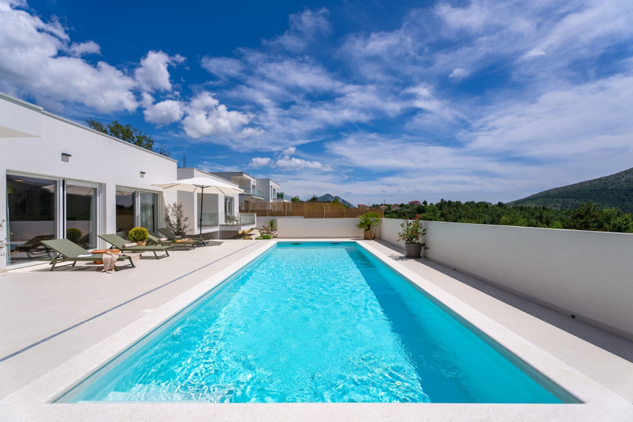 Surrounded by a spacious sun deck, guests will find six inviting deck chairs strategically placed under sun umbrellas