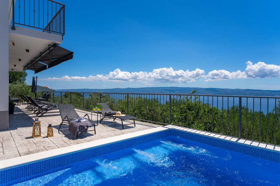 Outdoor space includes a 32 square meter (8 x 4 meter) private pool with hydromassage, a sun deck area with six deck chairs, a sun umbrella...