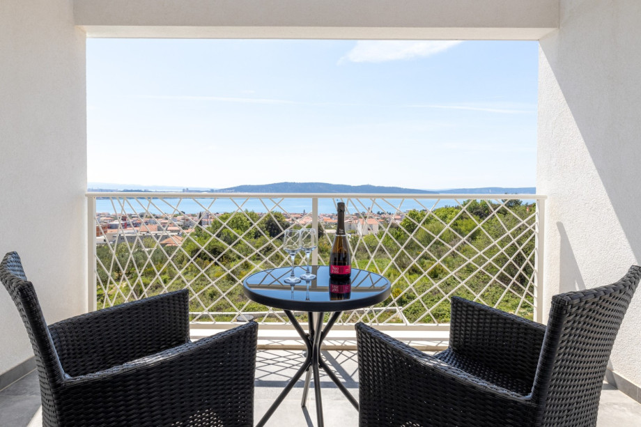 Balcony with outdoor furniture, sea views and views of town Split