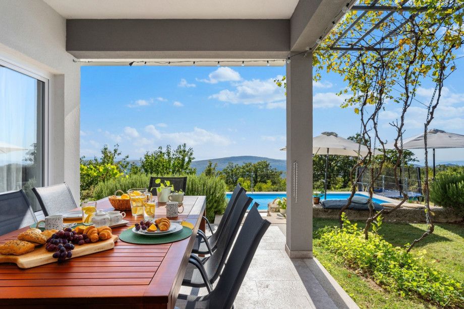 Outdoor dining area next to the house