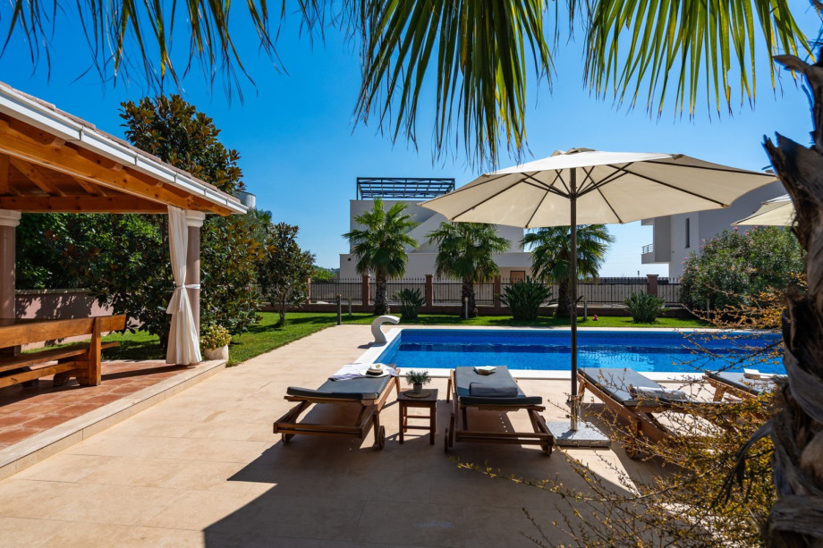 a private, heated 10m x 5m pool with massage system, 6 deck chairs and 2 parasols