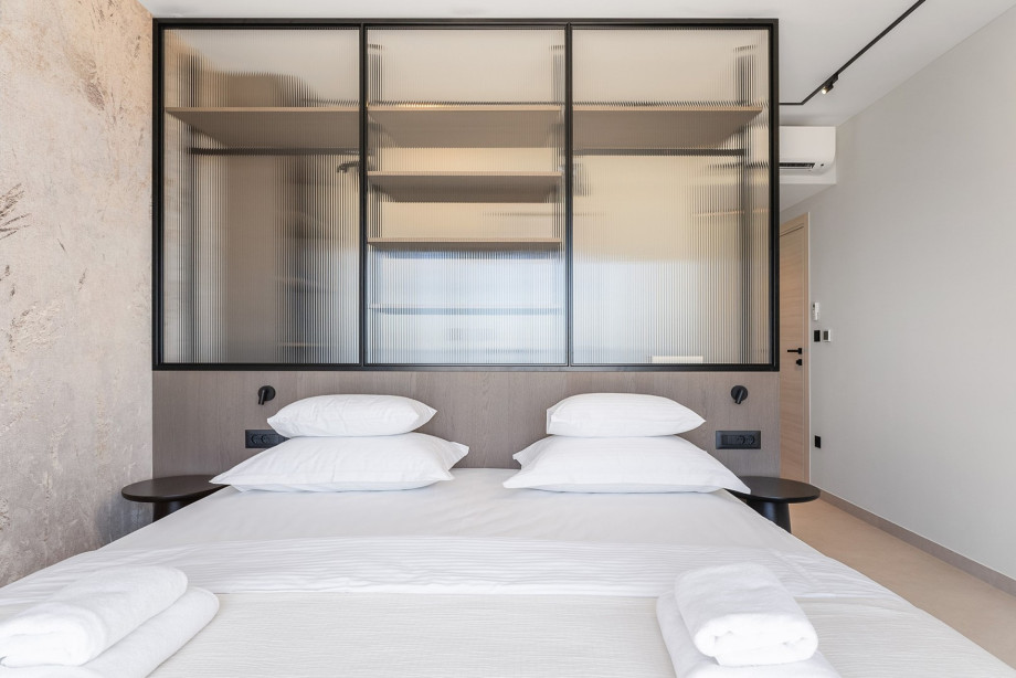 Bedroom No. 2 features a 200cm x 200cm super king-size bed, TV, A/C