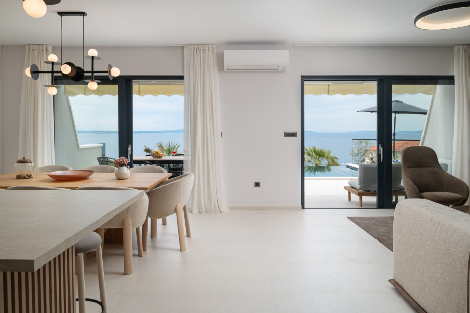 The modern kitchen contains such as a wine cooler, microwave, coffee maker, toaster, and kettle.