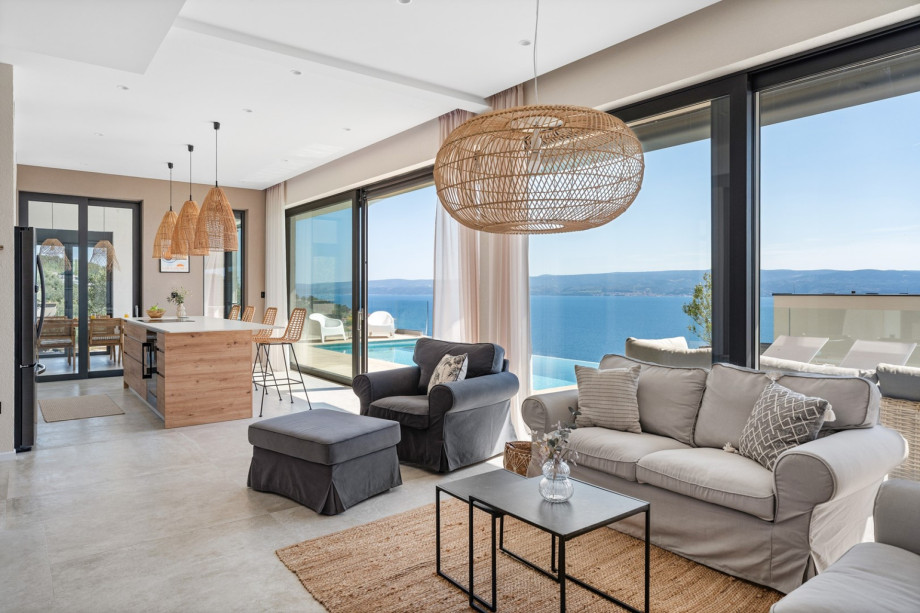 You are greeted by a cozy and stylishly decorated living area on the ground floor.