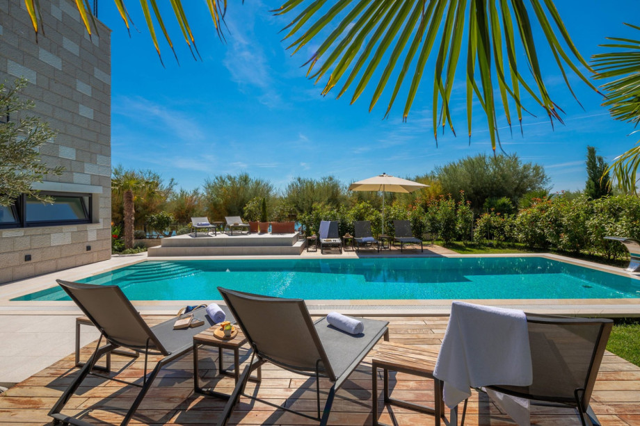 Private outdoor pool 12m x 5m settled on the sandy beach