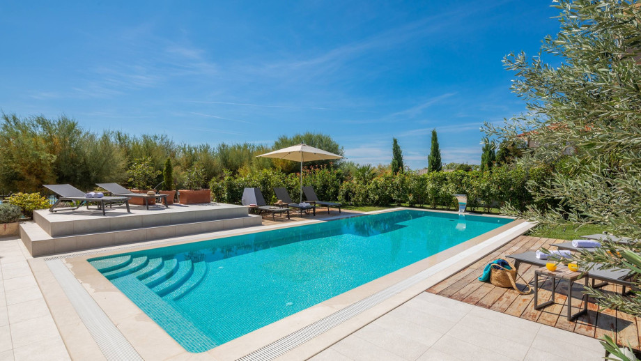 Unique location on the sandy beach with private pool fenced with Mediterranean plants