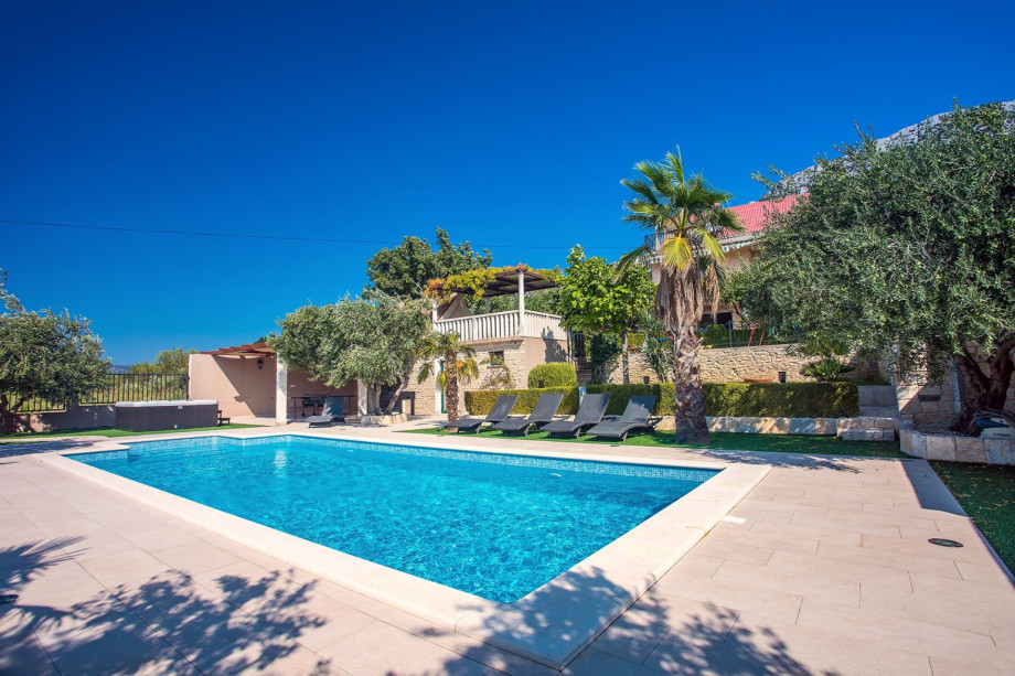 You can enjoy your pool privacy with  glass of Wine