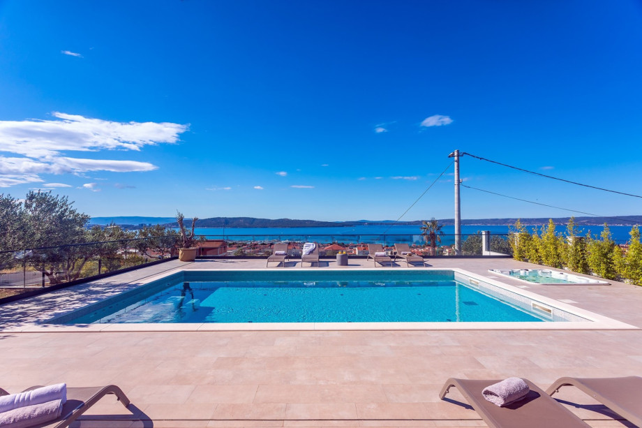 The outdoor area offers a 9m x 5m swimming pool with a huge sun deck.