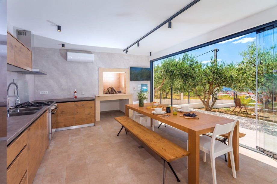 A glass wall provides views on the pool and outdoor area.