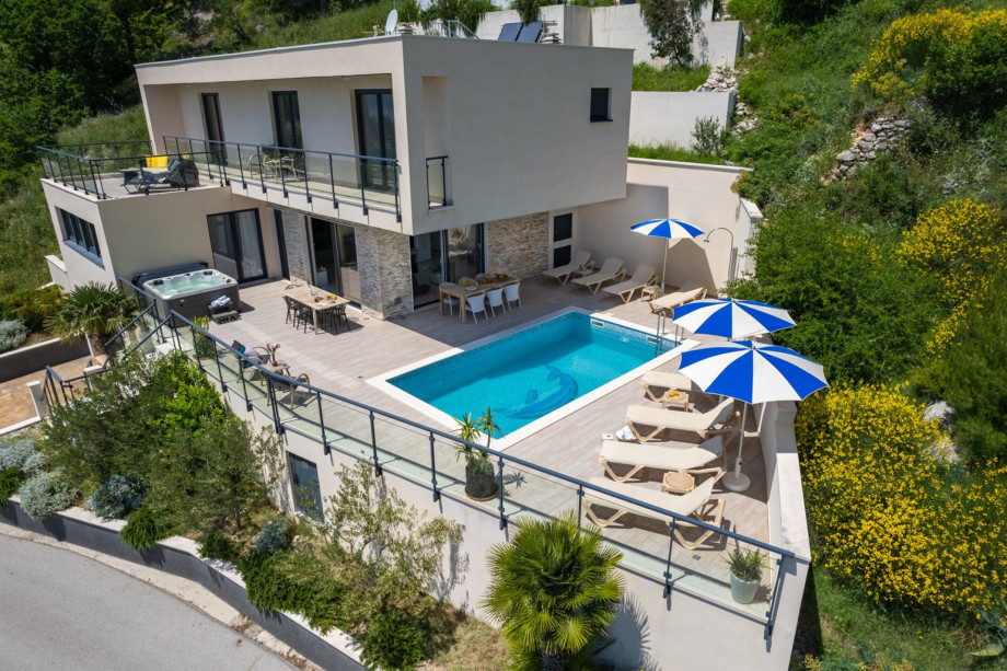 The villa is settled on a 700 sqm plot with 300sqm of living area spread on three levels