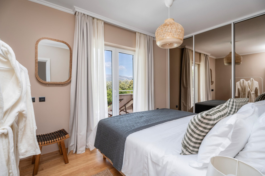 The third bedroom and a balcony overlooking the pool