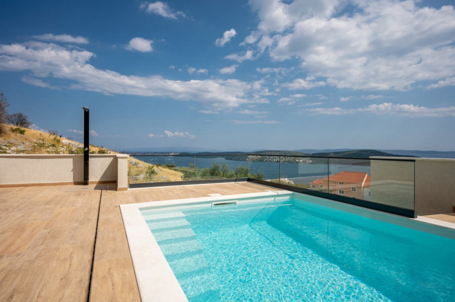Heated private swimming pool with a fantastic sea view and an outdoor shower.