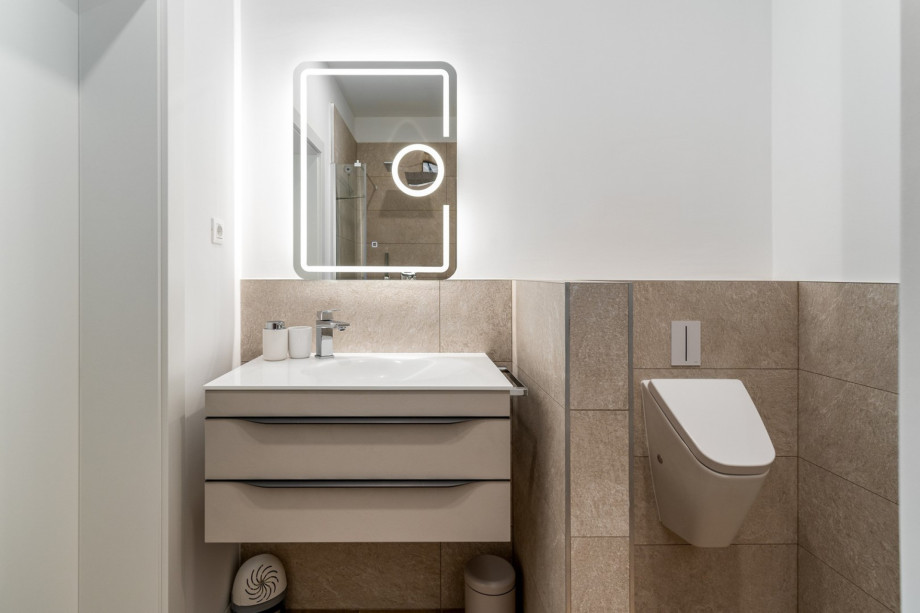 Family bathroom with a shower and a toilet