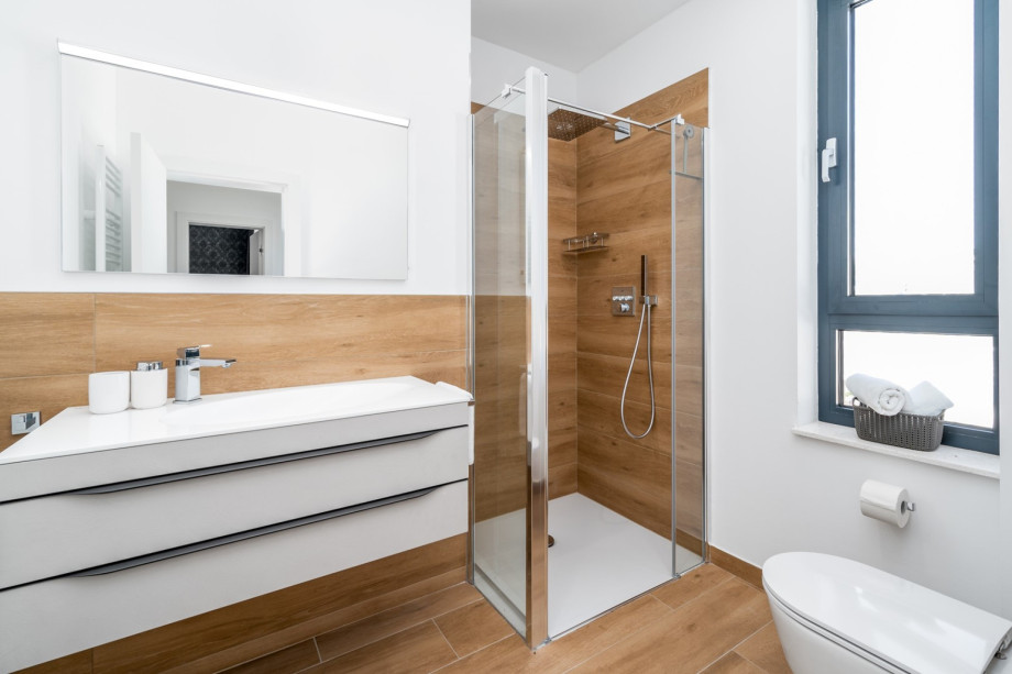 Family bathroom with a shower and a toilet.