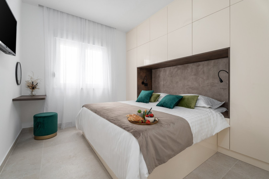 A Bedroom NO2 with a king-size bed 180cm x 200cm, a TV, air-conditioned