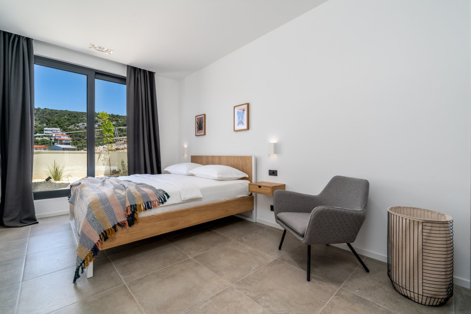 Bedroom NO4 with king size bed 180cm x 200cm with sea views and exit toward outdoors
