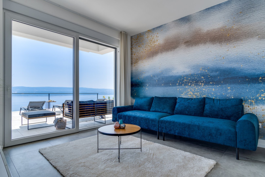 The living room with a direct exit to the pool area